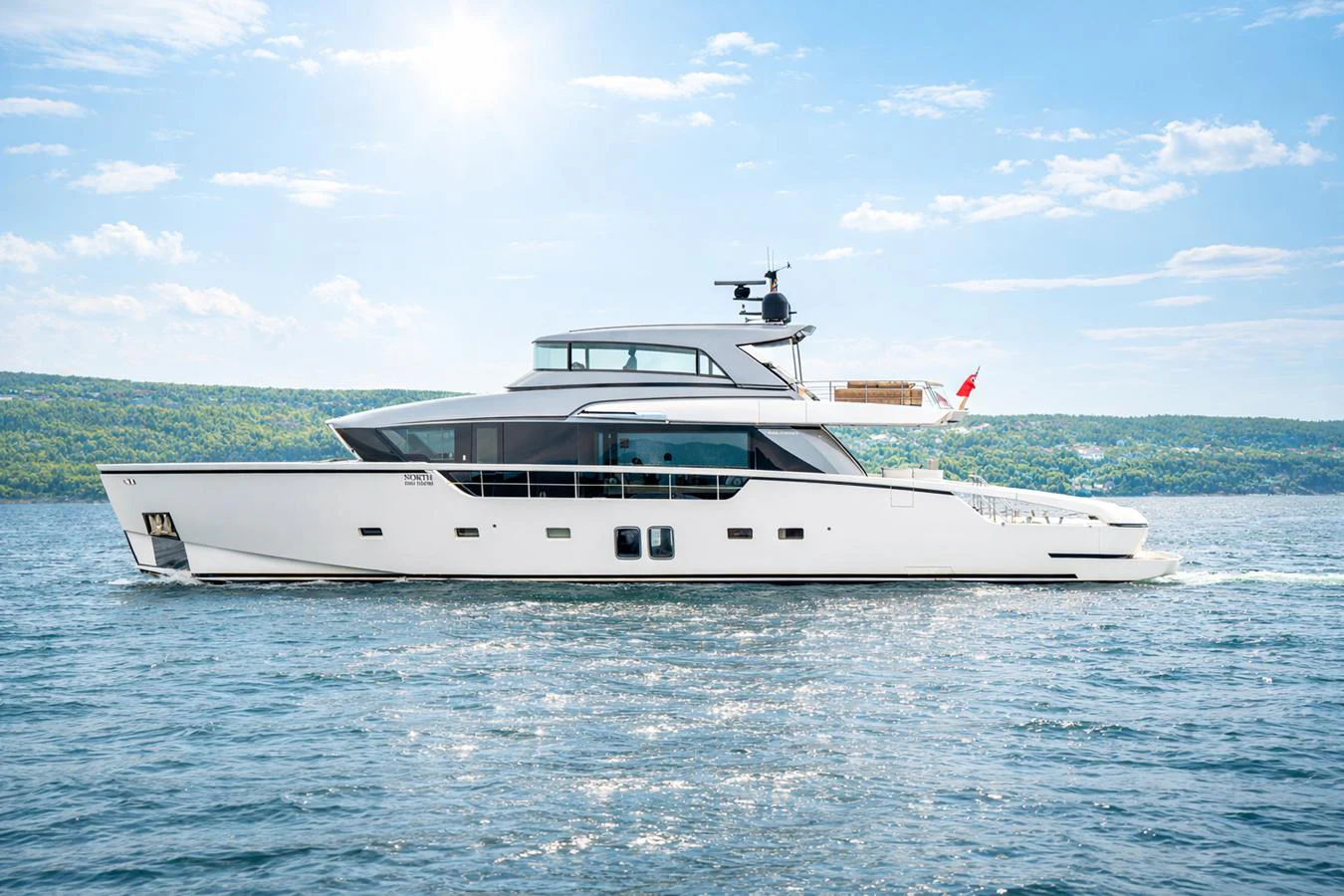 a white yacht in the water aboard NORTH Yacht for Sale
