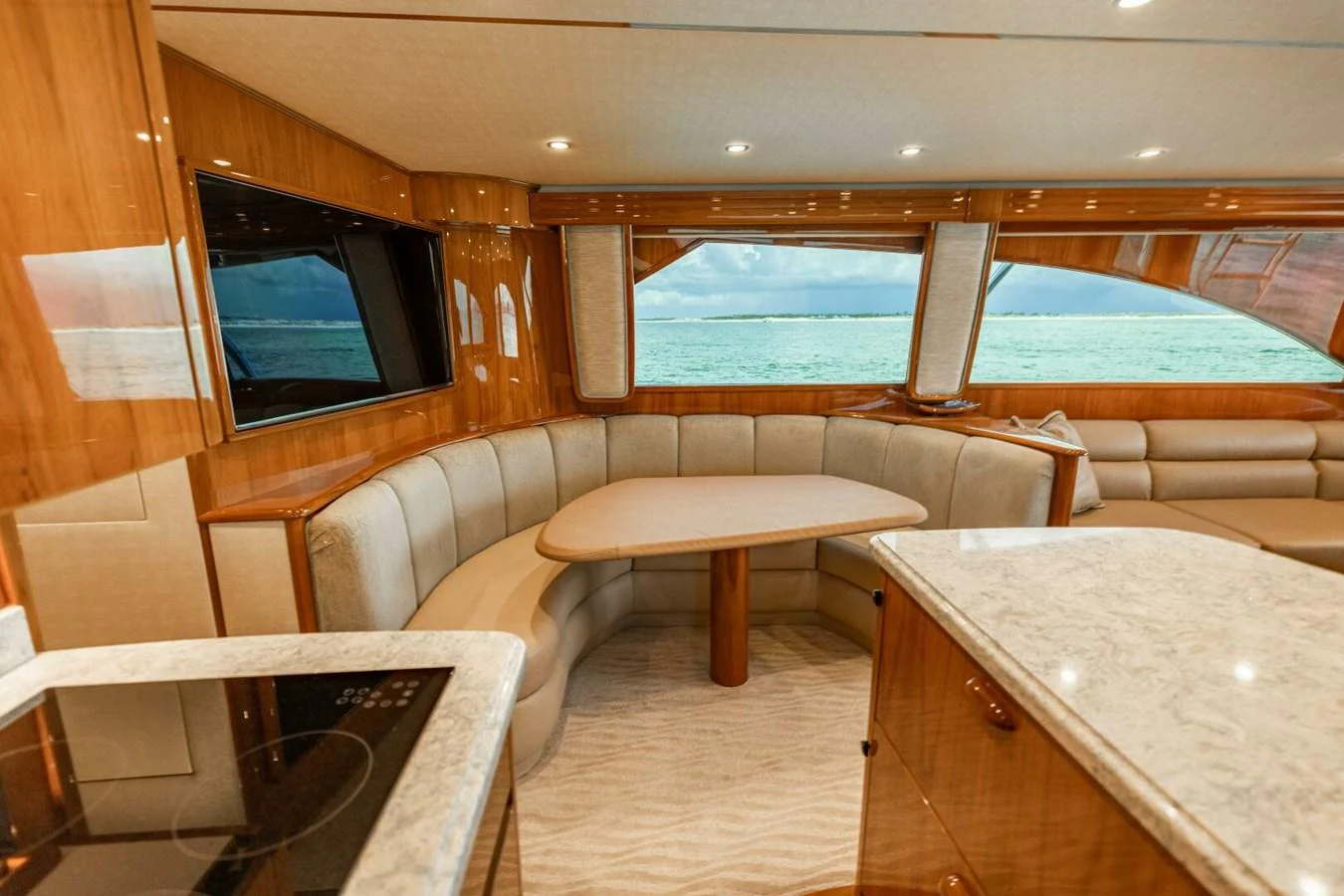 a room with a tv and a table aboard MISS VIRGINIA Yacht for Sale