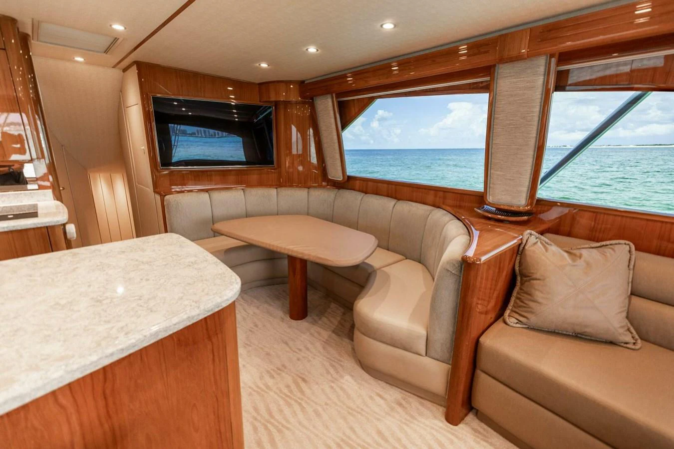 a room with a table and chairs aboard MISS VIRGINIA Yacht for Sale