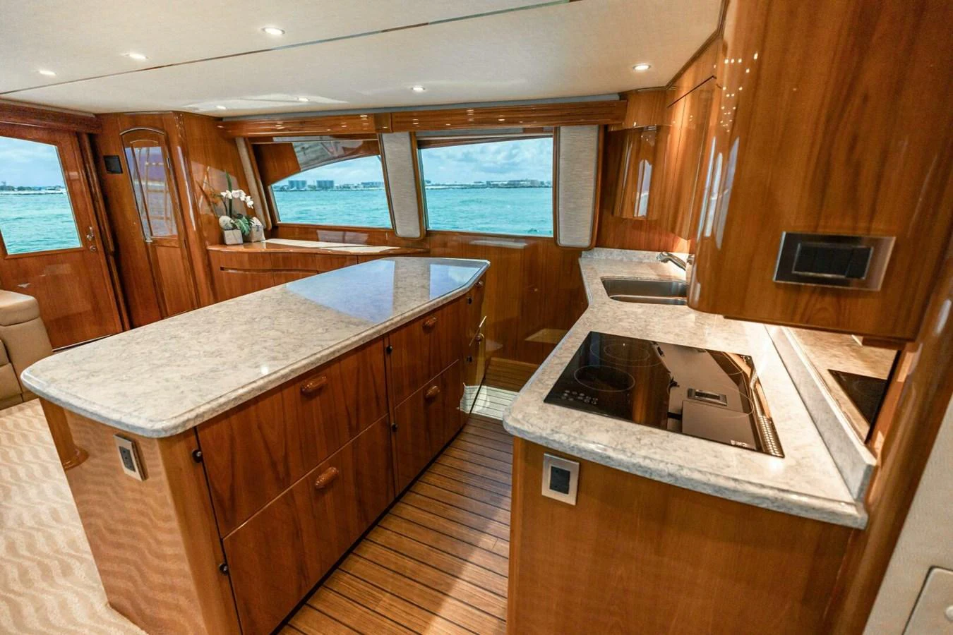 a kitchen with wooden cabinets aboard MISS VIRGINIA Yacht for Sale
