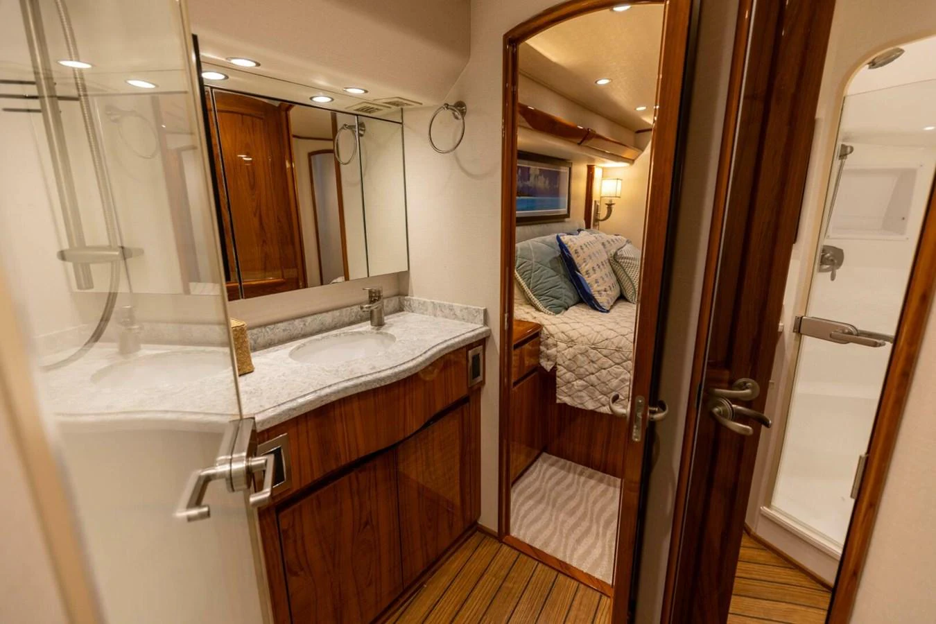 a bathroom with a large mirror aboard MISS VIRGINIA Yacht for Sale