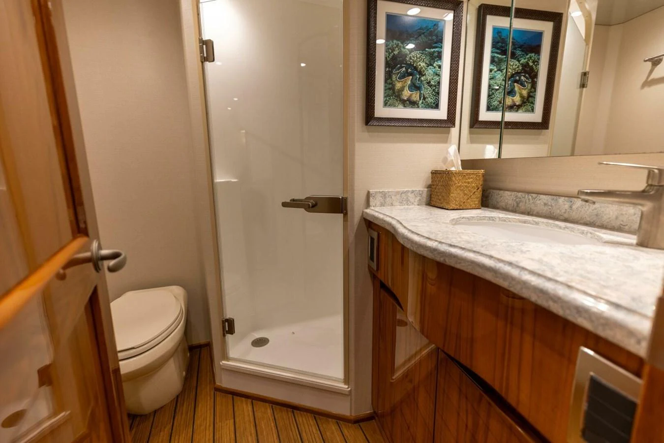 a bathroom with a sink toilet and a shower aboard MISS VIRGINIA Yacht for Sale