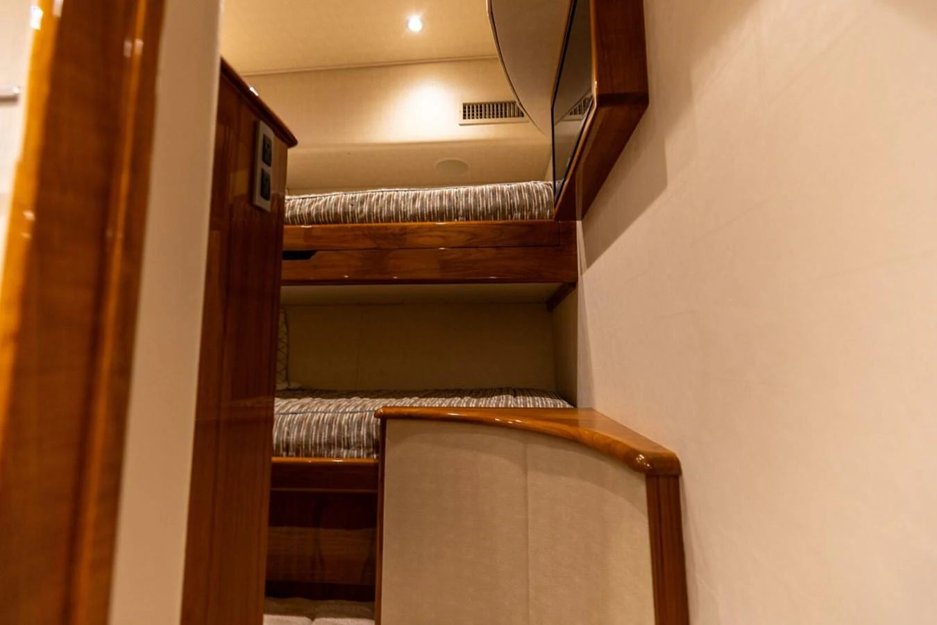a room with a bed and a chair aboard MISS VIRGINIA Yacht for Sale