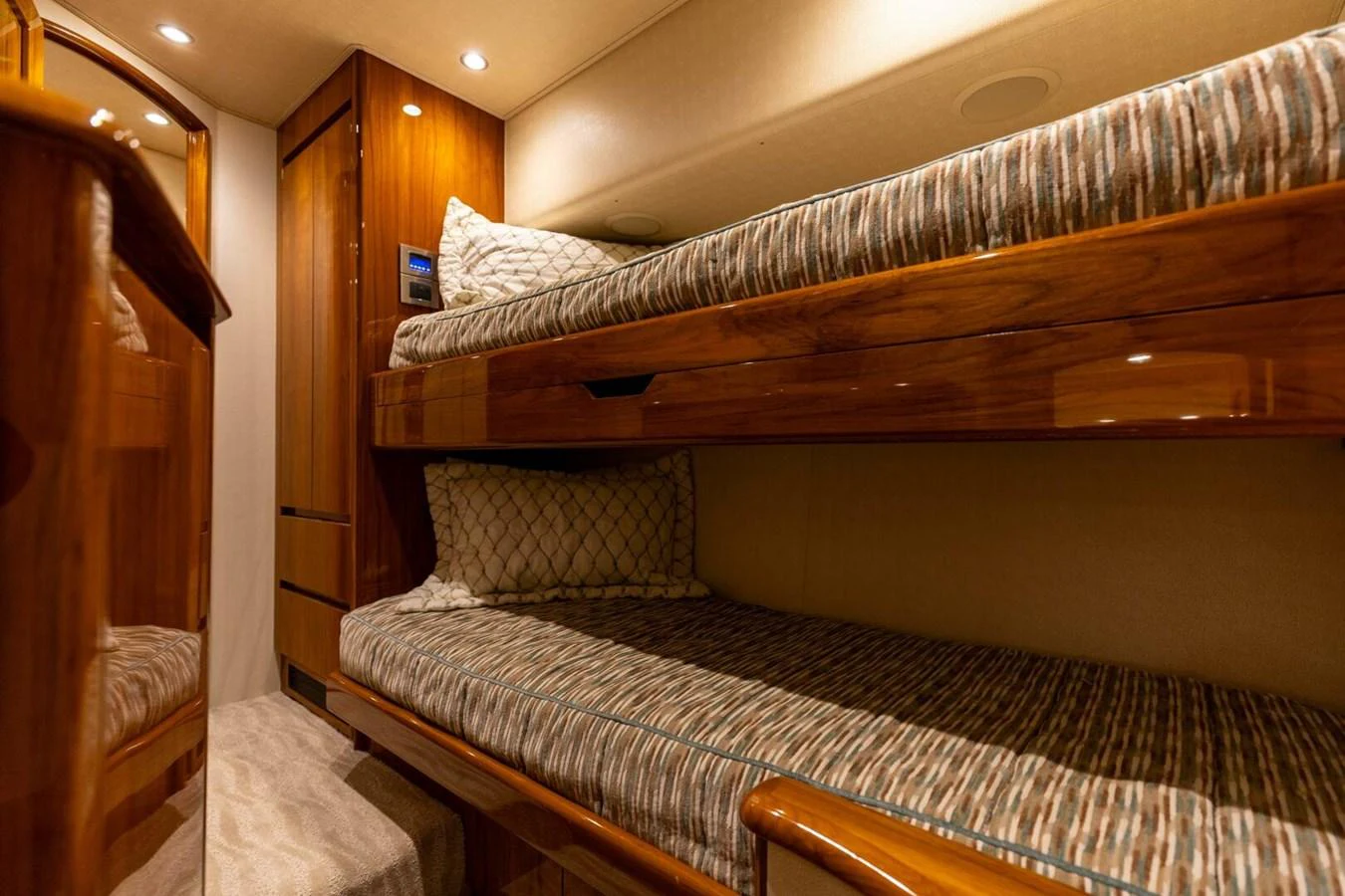 a bed with a wooden headboard aboard MISS VIRGINIA Yacht for Sale