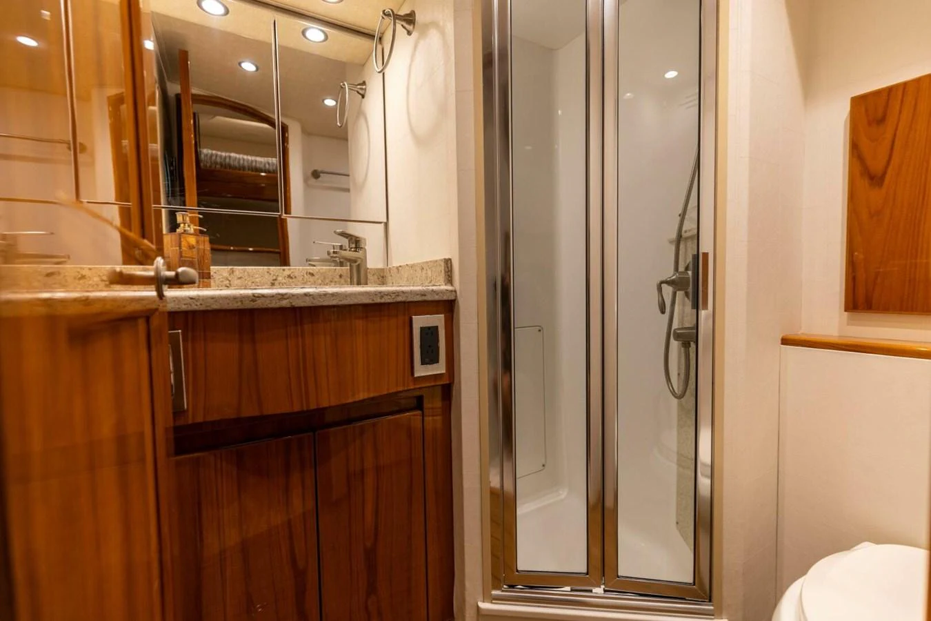 a bathroom with a glass shower aboard MISS VIRGINIA Yacht for Sale