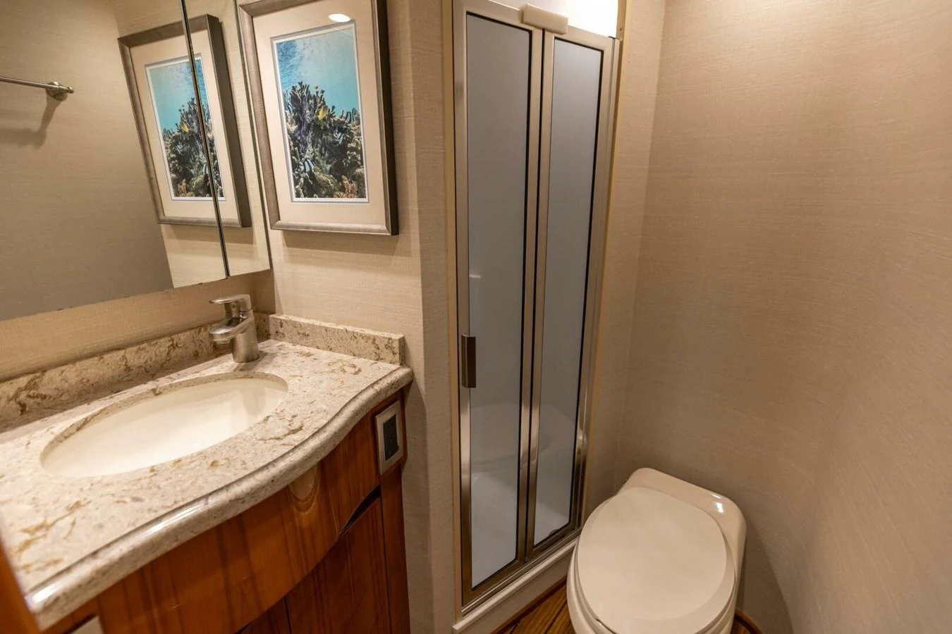 a bathroom with a sink and a toilet aboard MISS VIRGINIA Yacht for Sale