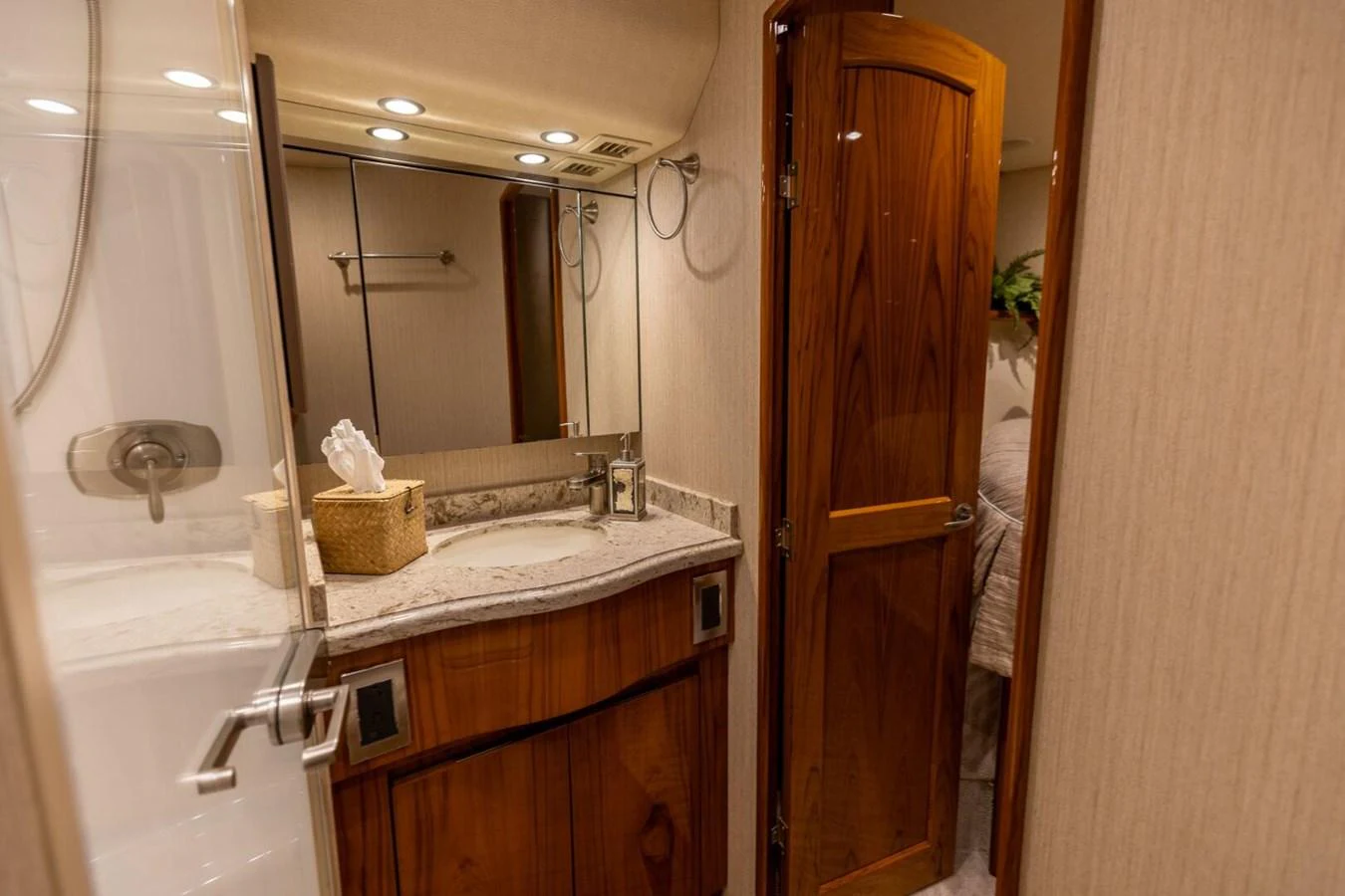 a bathroom with a sink and a mirror aboard MISS VIRGINIA Yacht for Sale
