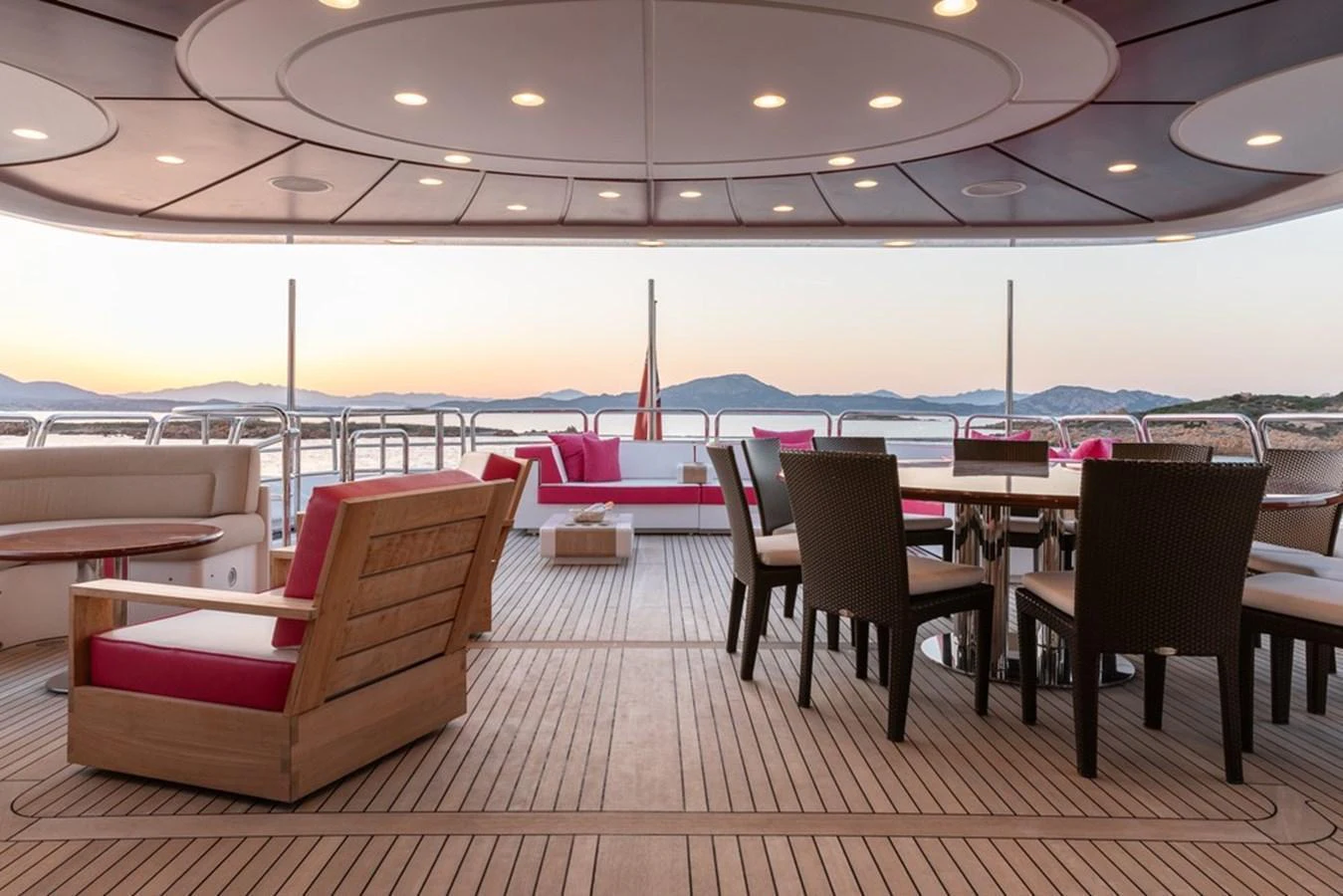 The aft deck offers a luxurious outdoor seating and dining area with stunning views. aboard VIRTUE Yacht for Sale