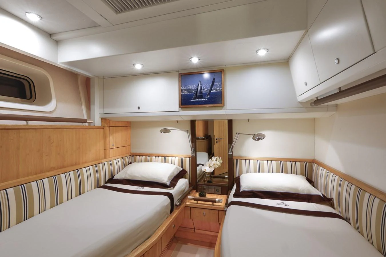 a room with two beds aboard CAPRICORNO Yacht for Sale