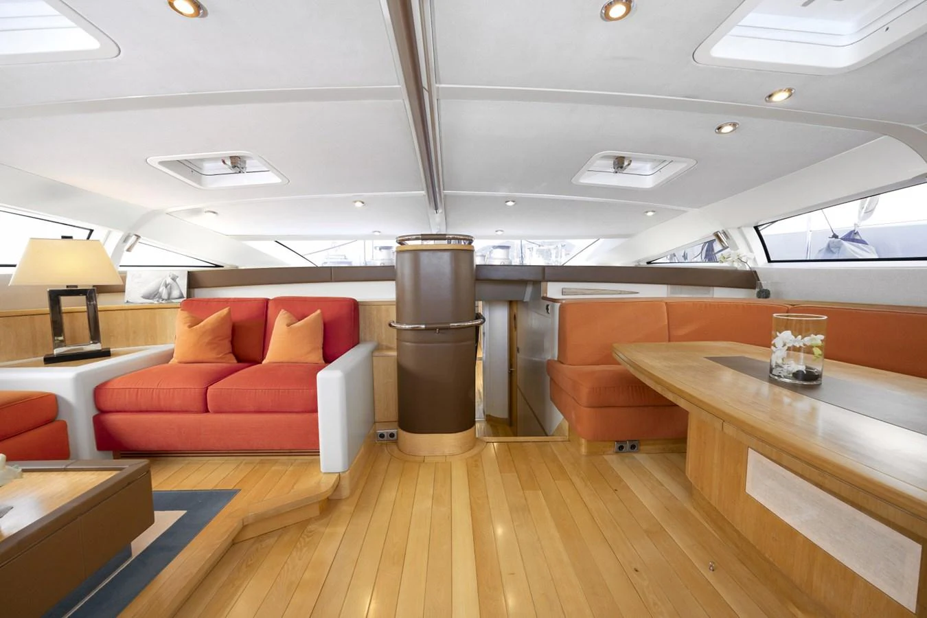 a room with a couch and a table aboard CAPRICORNO Yacht for Sale