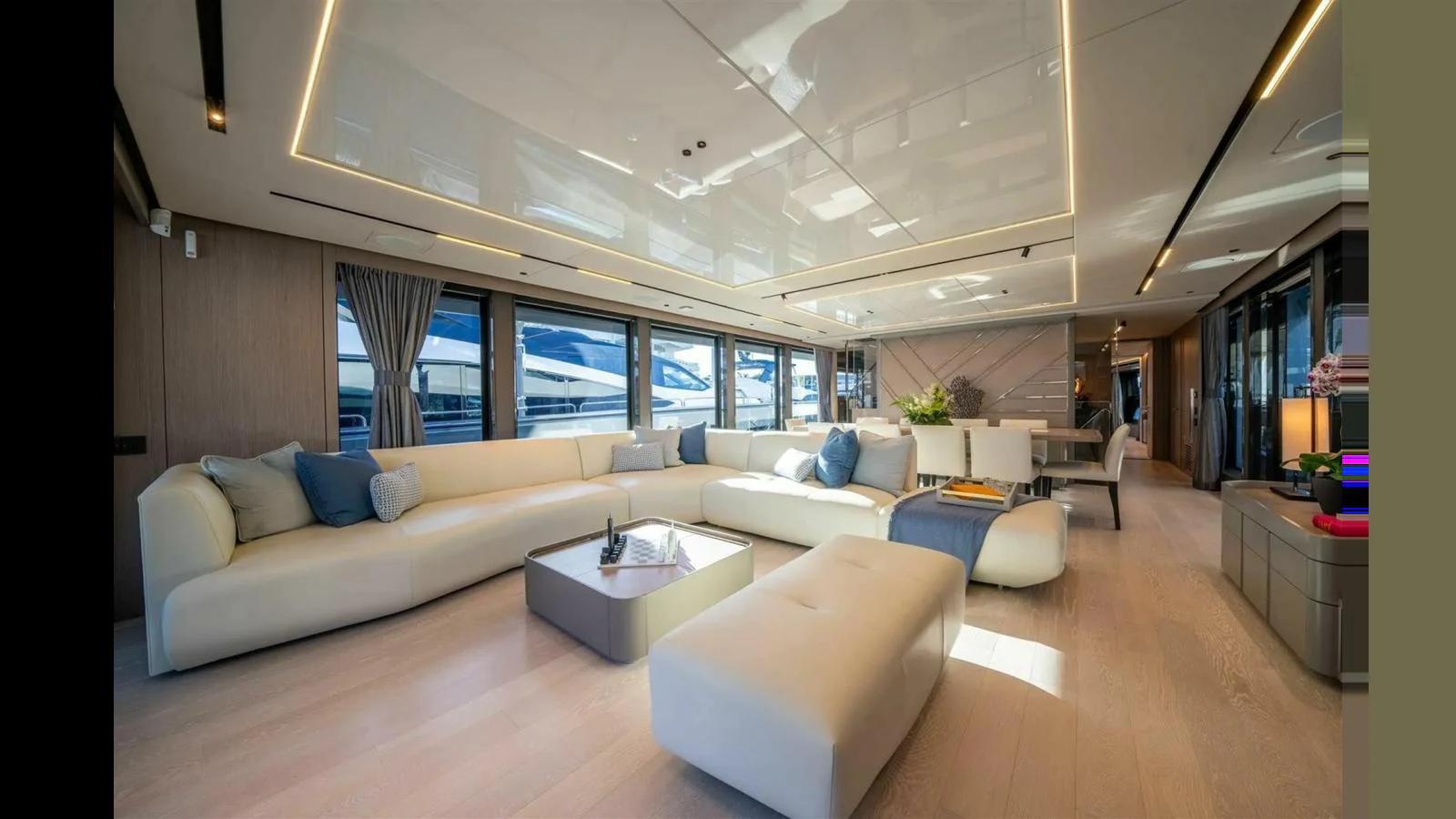 a living room with a large window aboard 100 YACHT Yacht for Sale