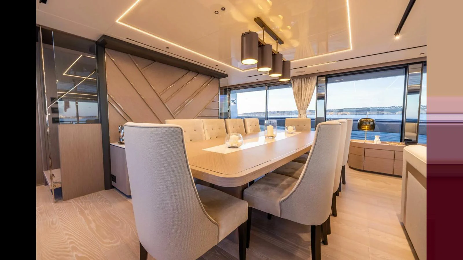 a room with a table and chairs aboard 100 YACHT Yacht for Sale