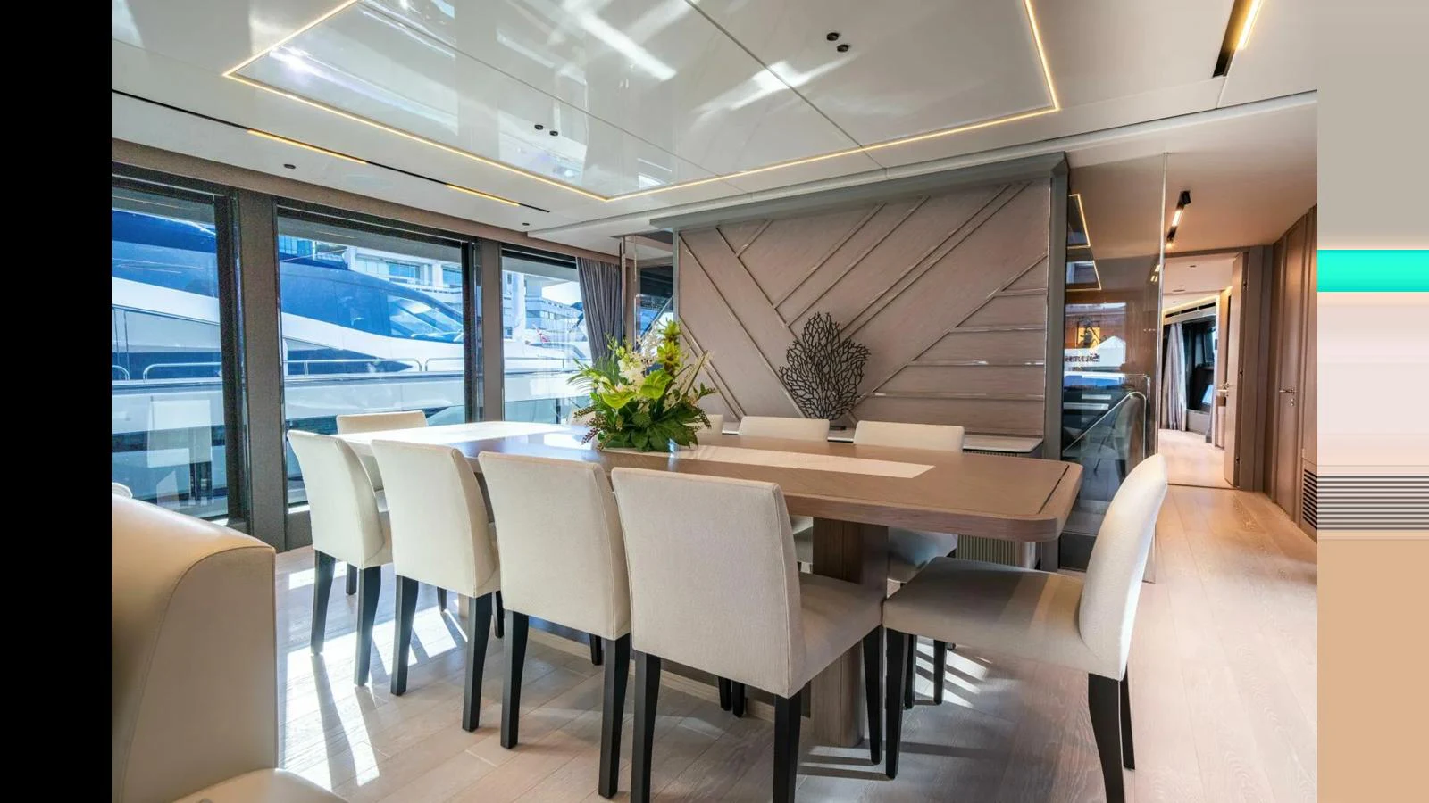 a room with a table and chairs aboard 100 YACHT Yacht for Sale