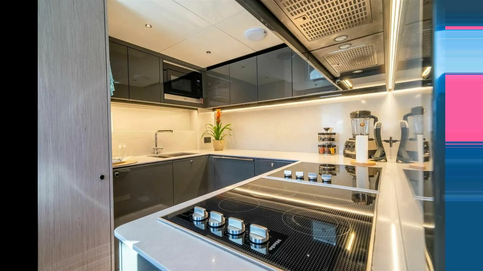 a kitchen with a stove and cabinets aboard 100 YACHT Yacht for Sale