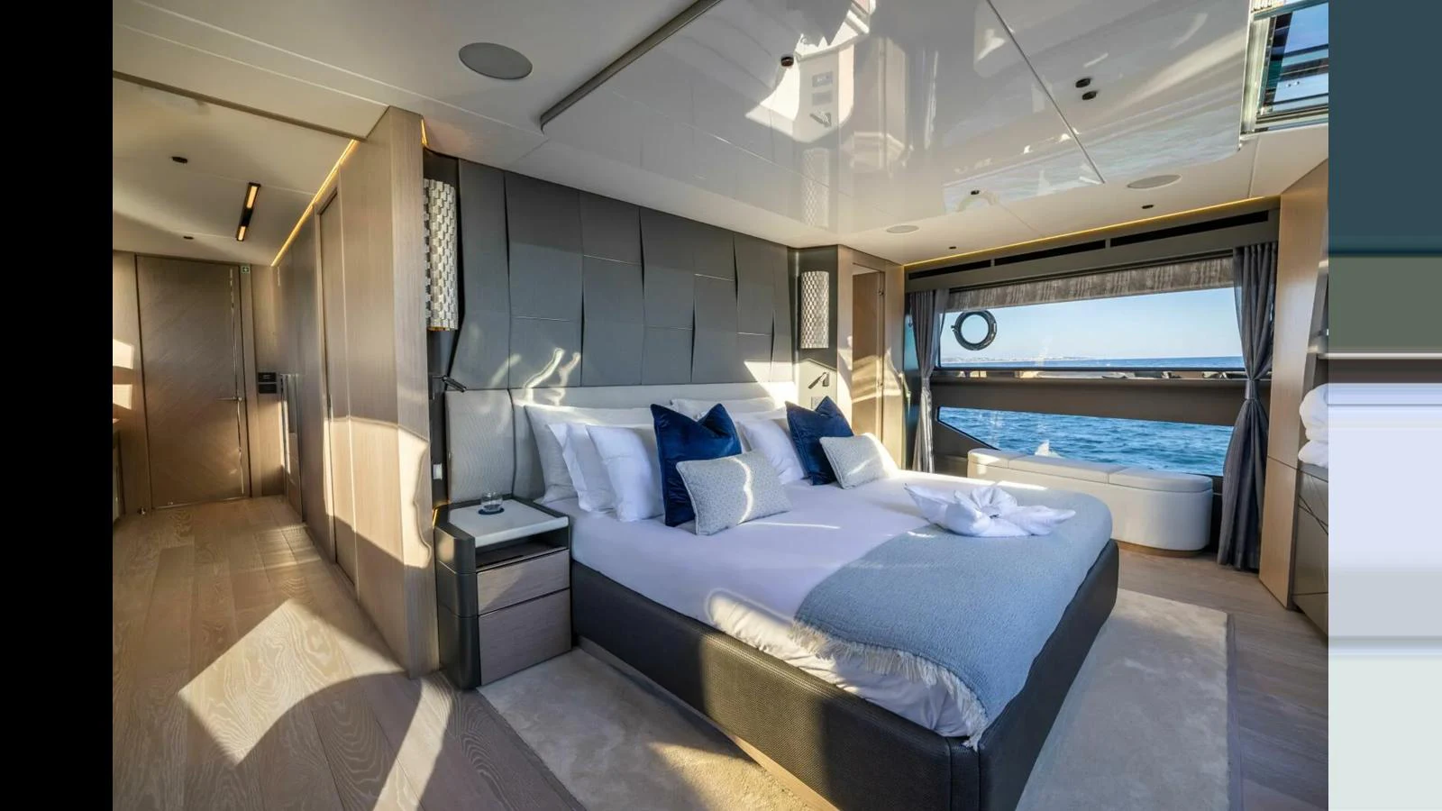 a room with a bed and a window aboard 100 YACHT Yacht for Sale