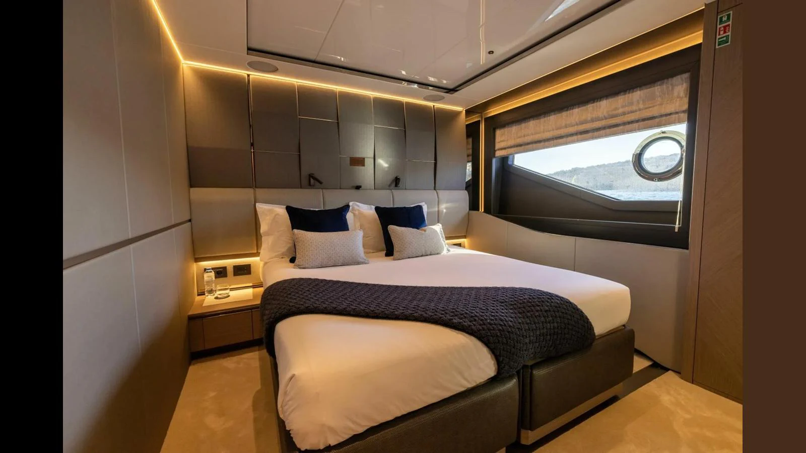 a bed with a blue blanket aboard 100 YACHT Yacht for Sale