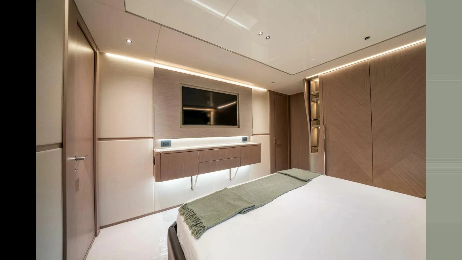 a room with a bed and a television aboard 100 YACHT Yacht for Sale
