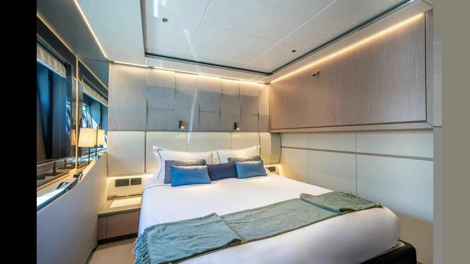 a room with a bed and a mirror aboard 100 YACHT Yacht for Sale