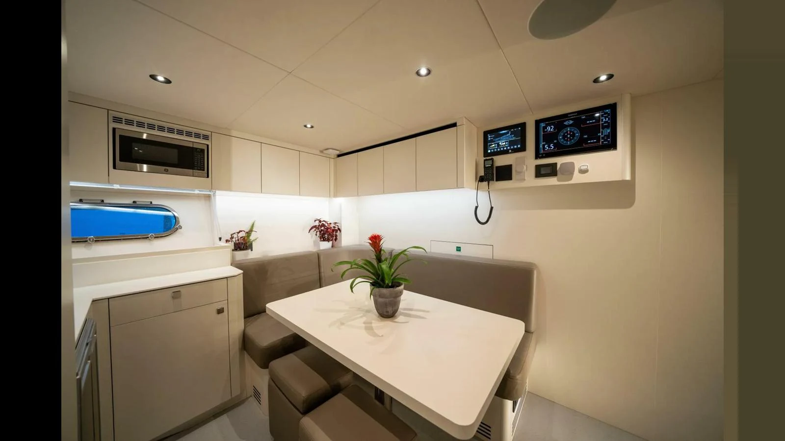 a kitchen with a table and chairs aboard 100 YACHT Yacht for Sale