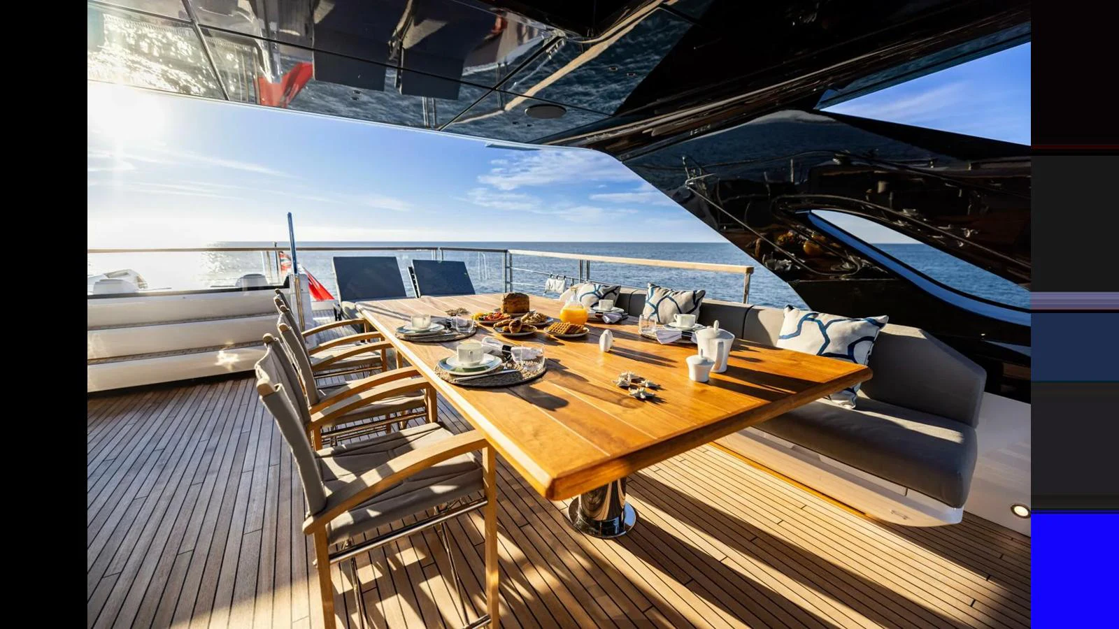 a table on a deck aboard 100 YACHT Yacht for Sale