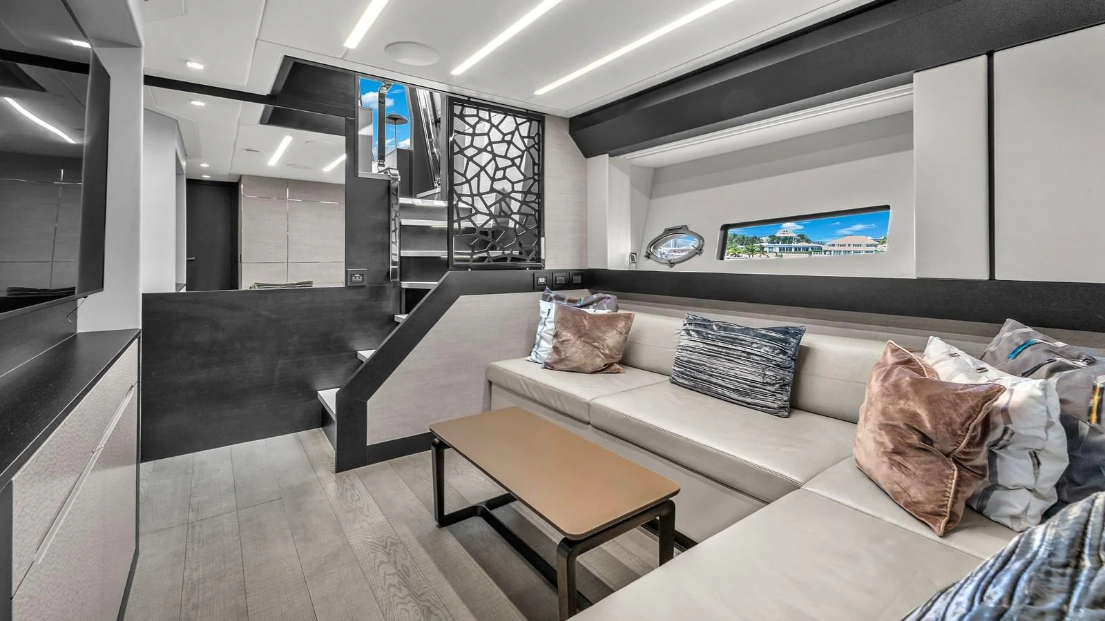 a room with a couch and a table and a tv aboard ALEXANDRA Yacht for Sale