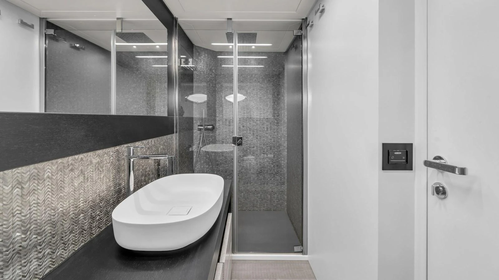 a bathroom with a sink and a shower aboard ALEXANDRA Yacht for Sale