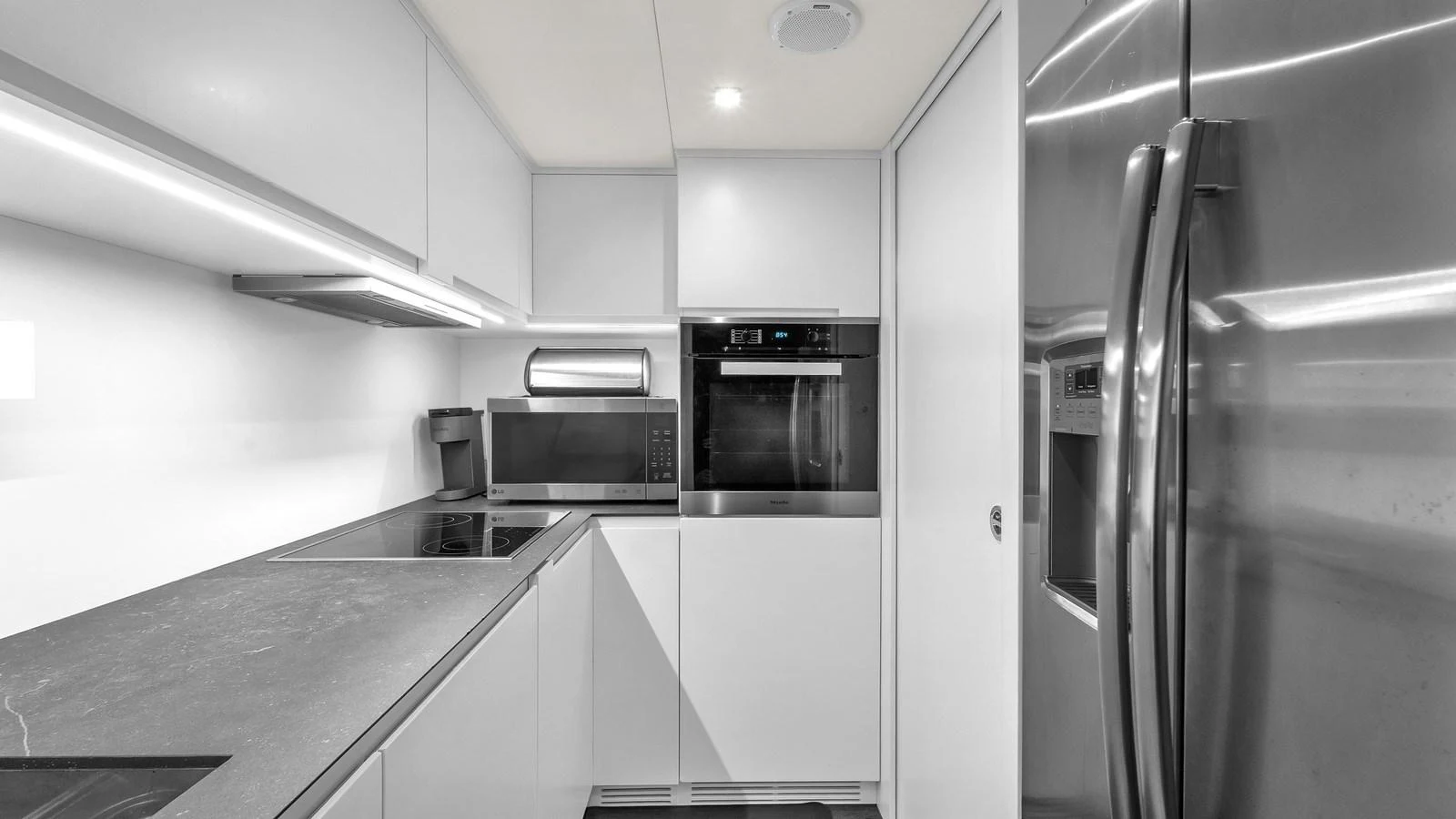 a kitchen with stainless steel appliances aboard ALEXANDRA Yacht for Sale