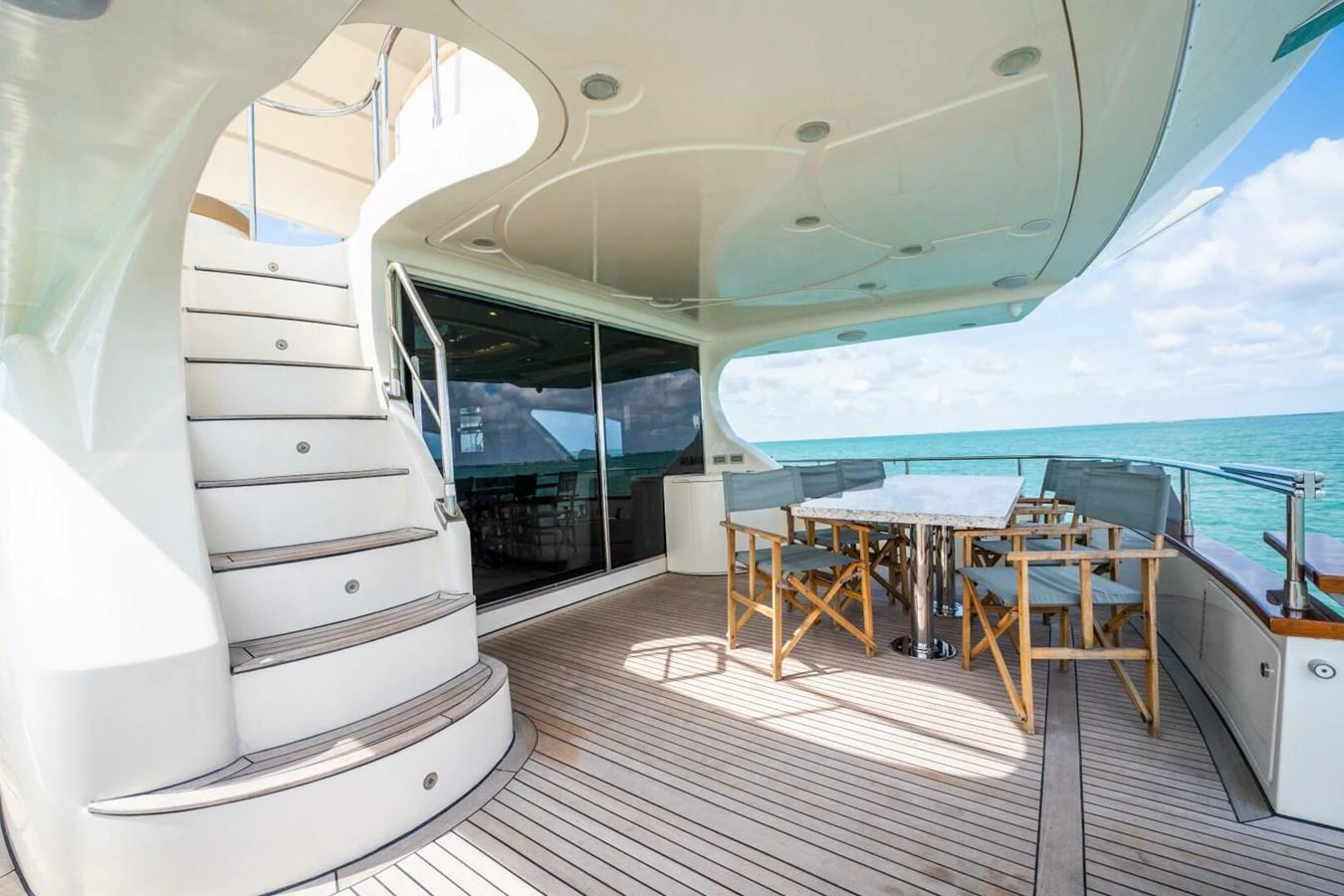 a room with a table and chairs aboard AZURE Yacht for Sale
