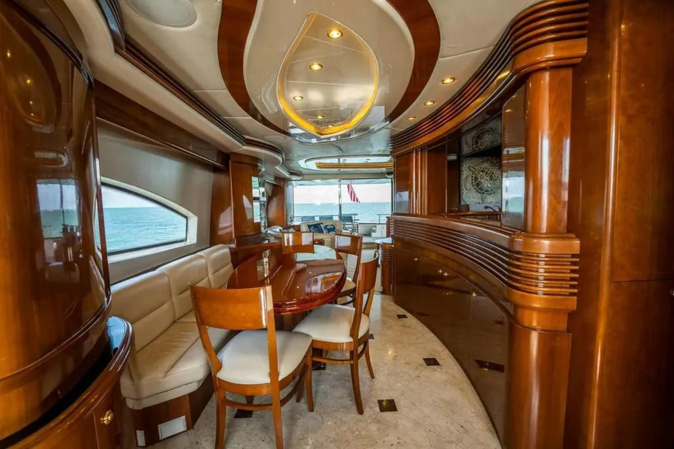 a room with a table and chairs aboard AZURE Yacht for Sale
