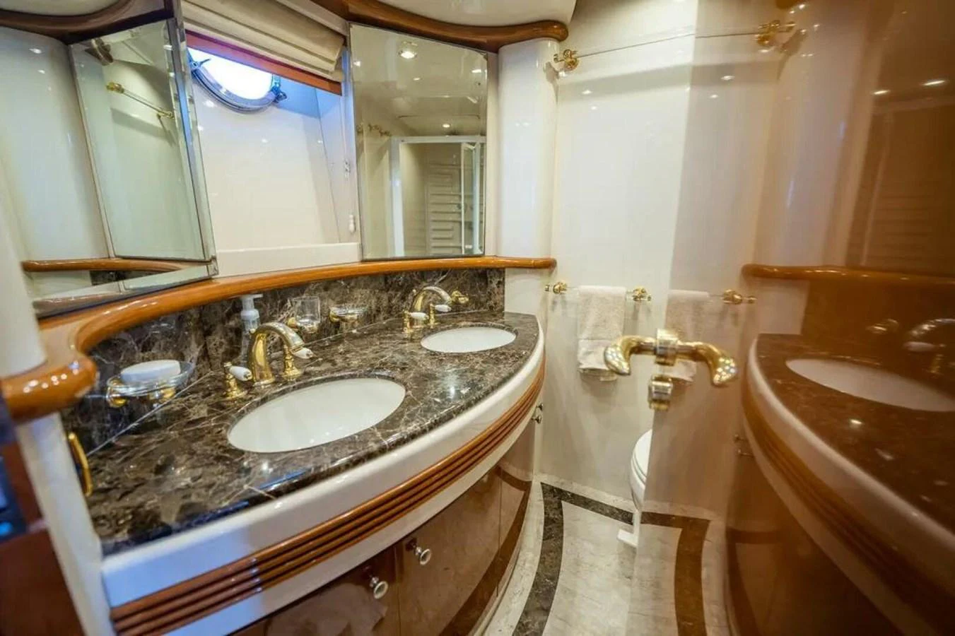 a bathroom with a sink and bathtub aboard AZURE Yacht for Sale