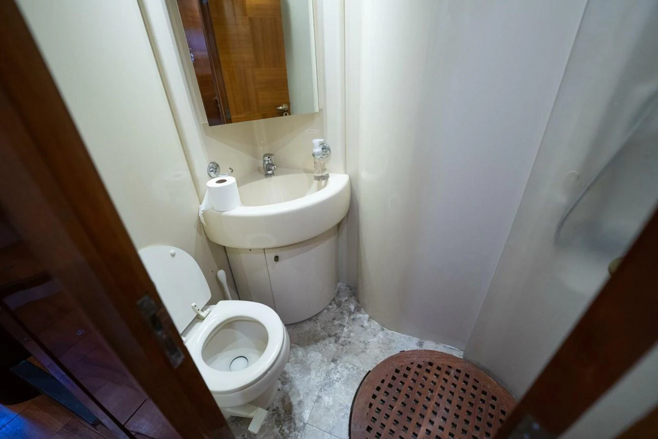 a bathroom with a toilet and sink aboard AZURE Yacht for Sale