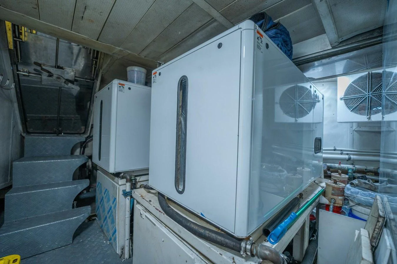 a large white machine in a room aboard AZURE Yacht for Sale