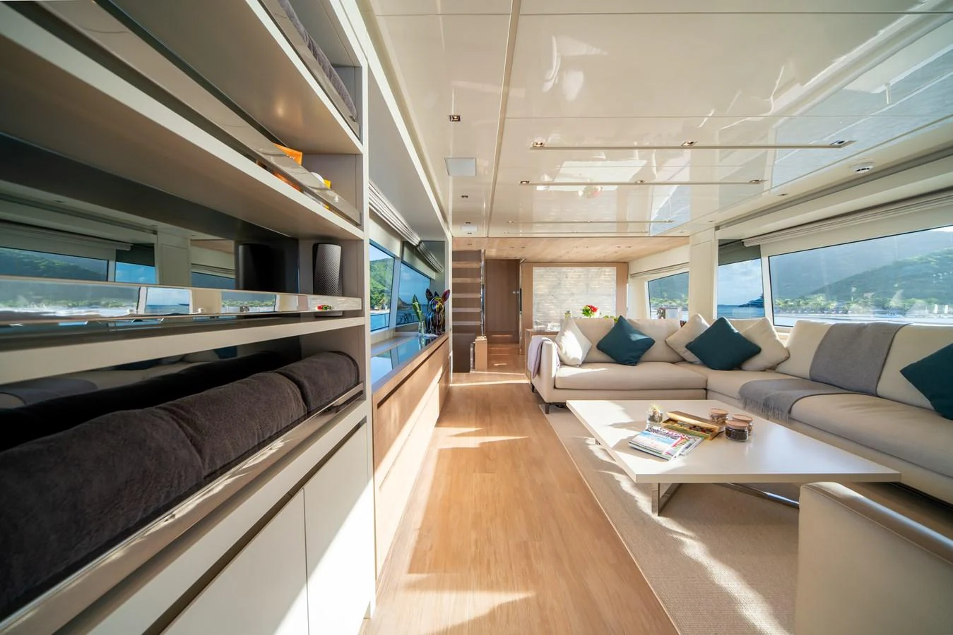 The spacious salon features modern furnishings and large windows for natural light. aboard AKULA Yacht for Sale