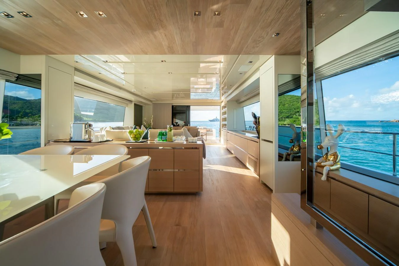 The yacht's salon features a spacious and modern design with ample natural light and elegant furnishings. aboard AKULA Yacht for Sale