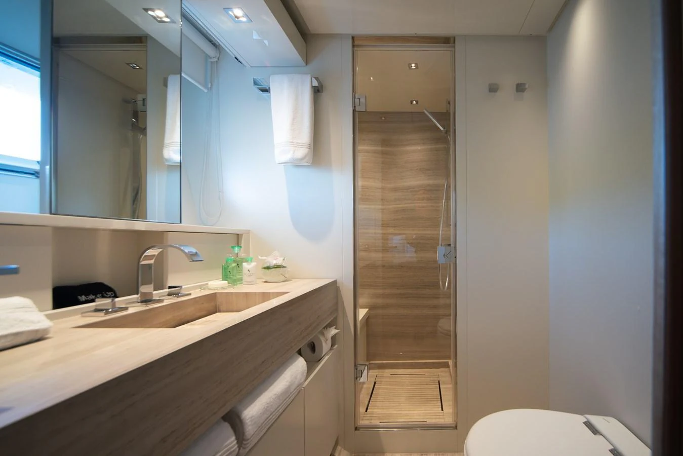 A modern and sleek bathroom with a spacious shower and elegant fixtures. aboard AKULA Yacht for Sale