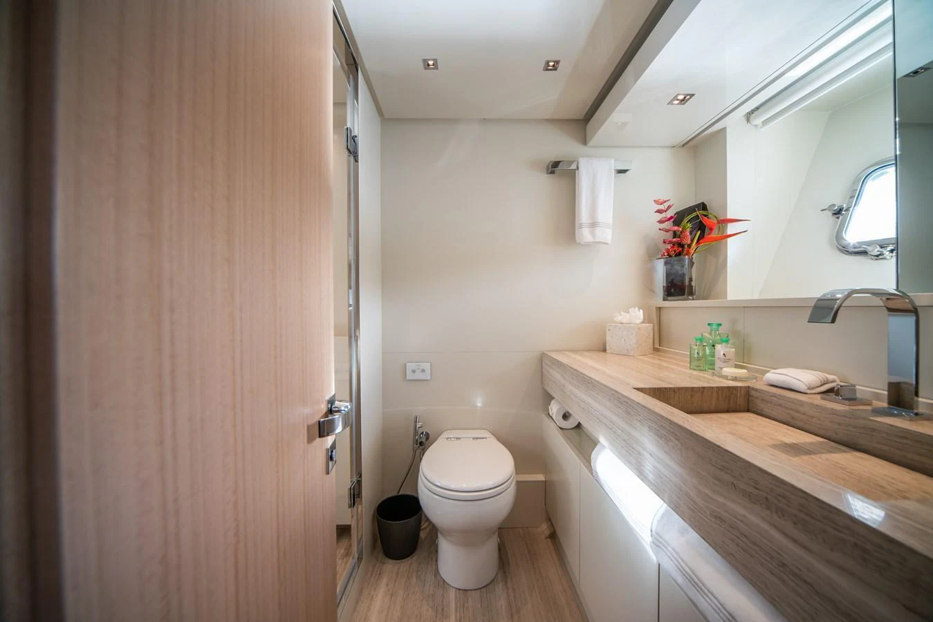 The yacht's bathroom features modern fixtures and a sleek design. aboard AKULA Yacht for Sale