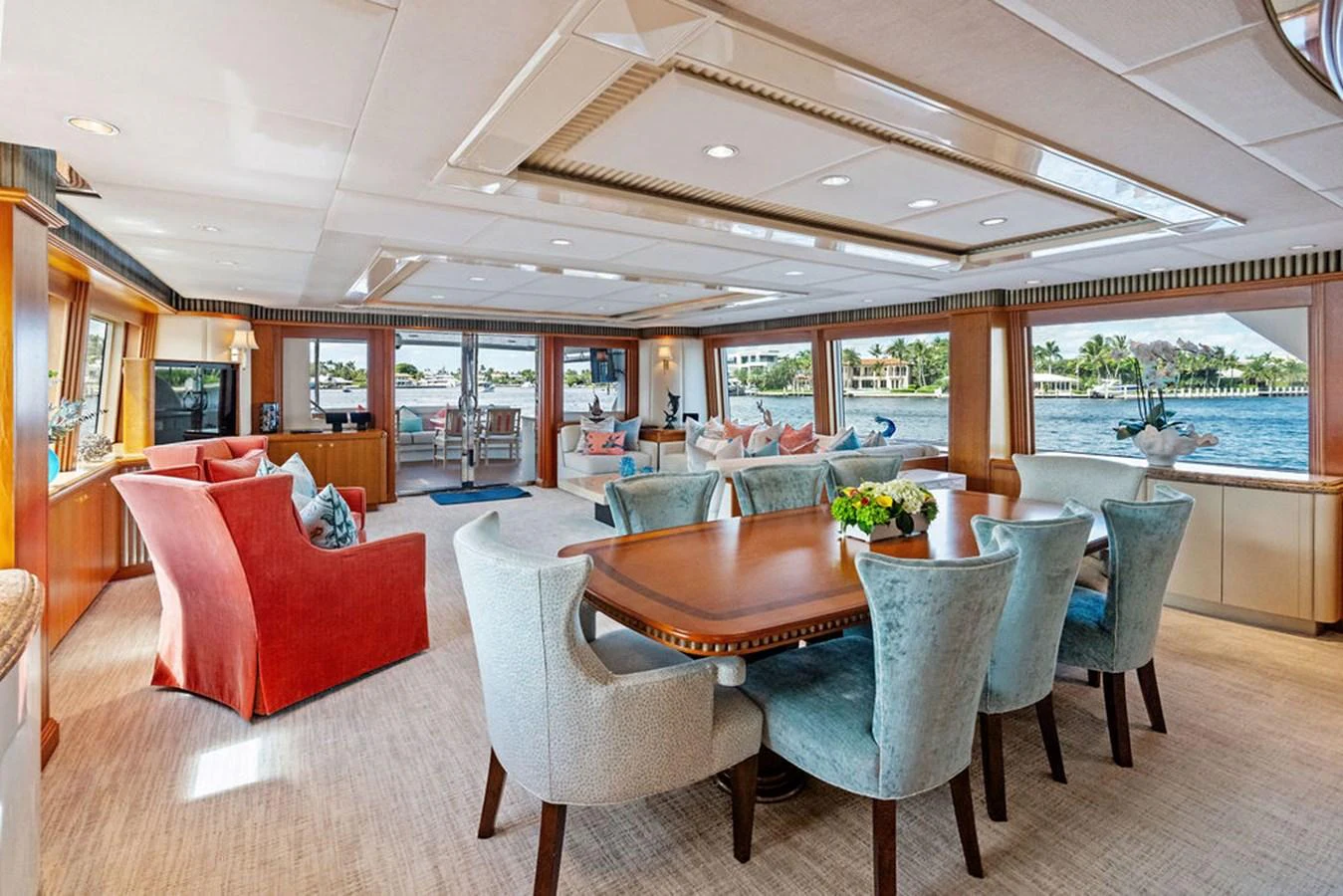 a large living room with a table and chairs aboard PICOSA LADY Yacht for Sale