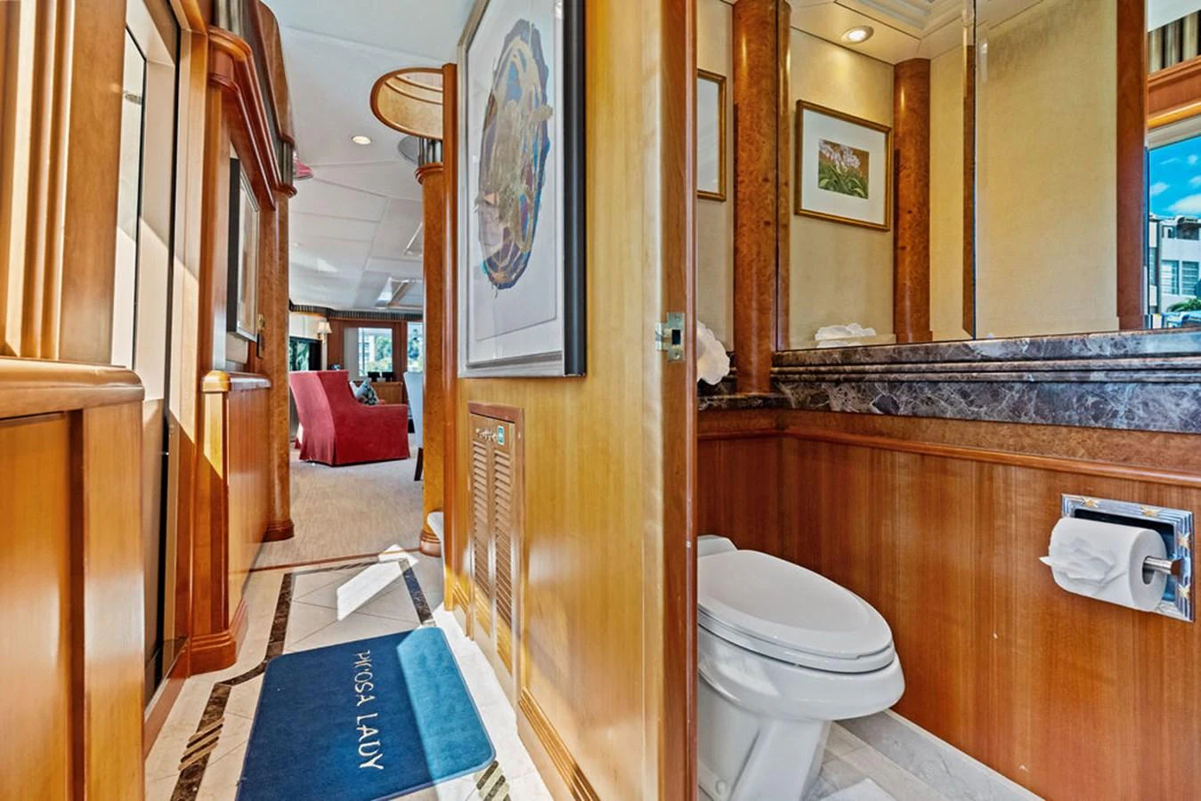 a bathroom with a toilet and a mirror aboard PICOSA LADY Yacht for Sale