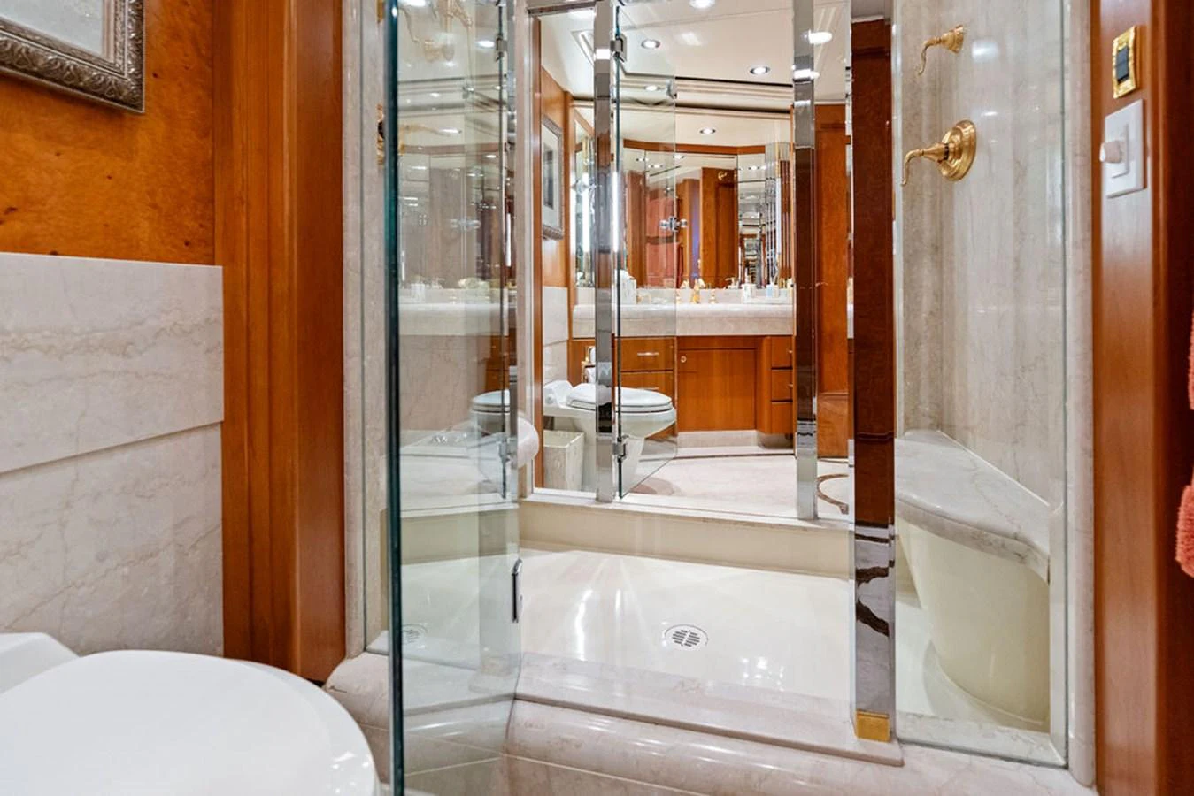 a bathroom with a glass shower aboard PICOSA LADY Yacht for Sale