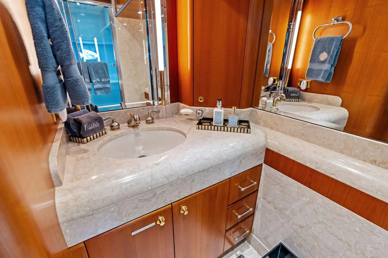 a bathroom with a sink and a mirror aboard PICOSA LADY Yacht for Sale