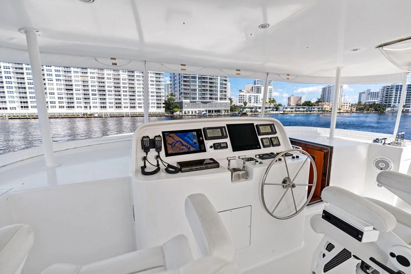 a white boat with a large white boat in the water aboard PICOSA LADY Yacht for Sale
