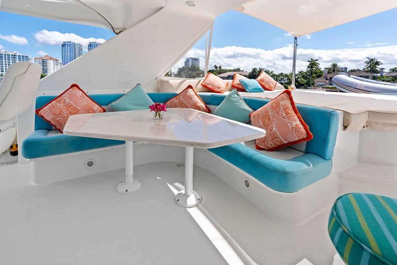 a white lounge chair with colorful pillows aboard PICOSA LADY Yacht for Sale
