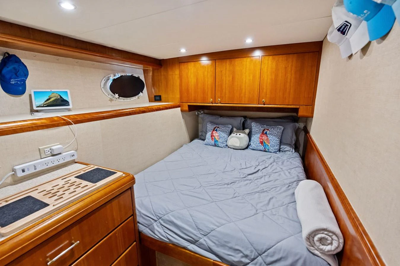 a bedroom with a bed and cabinets aboard PICOSA LADY Yacht for Sale