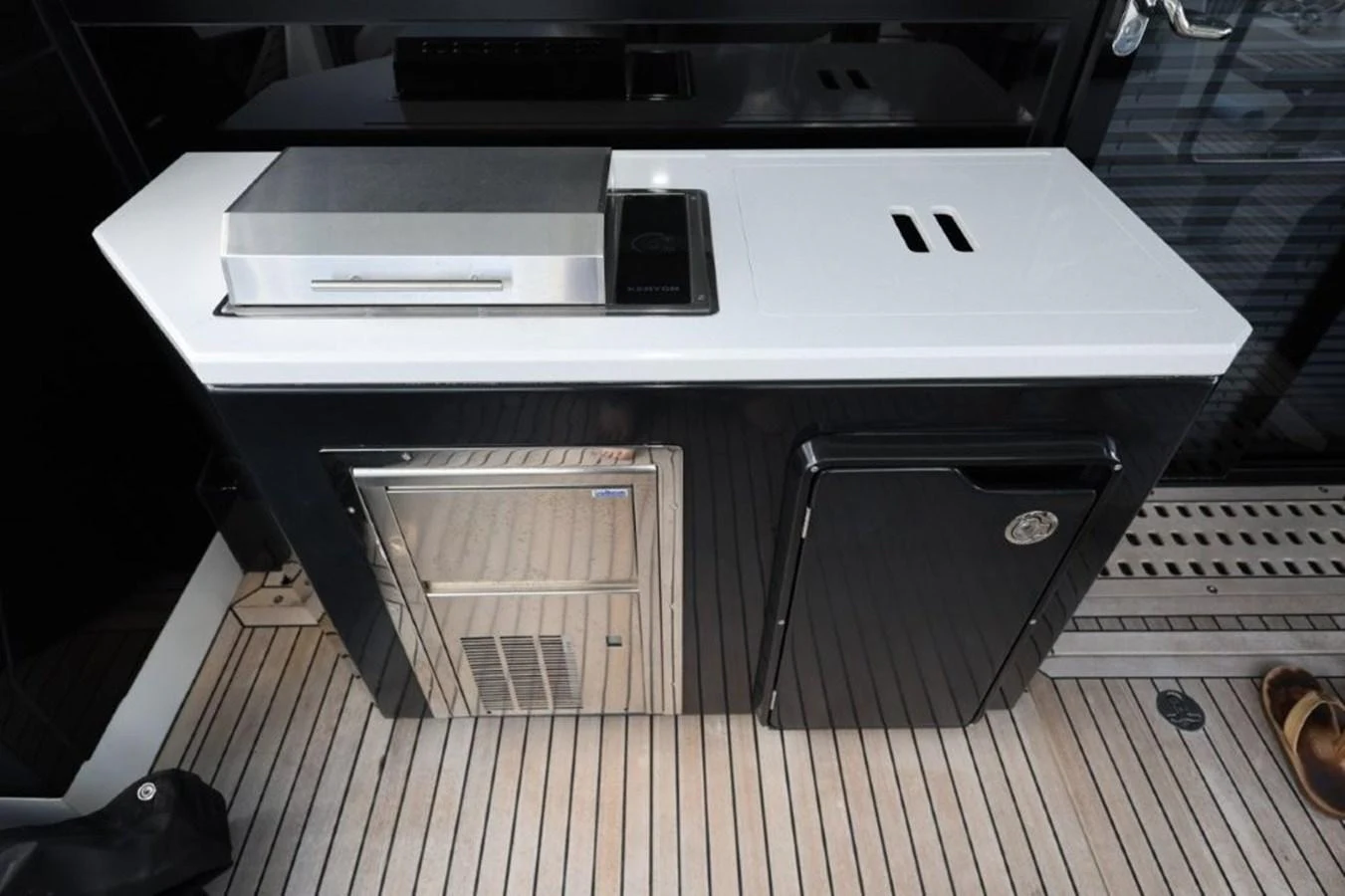 a white rectangular object with a black case and a black rectangular object aboard GLN65001J819 Yacht for Sale
