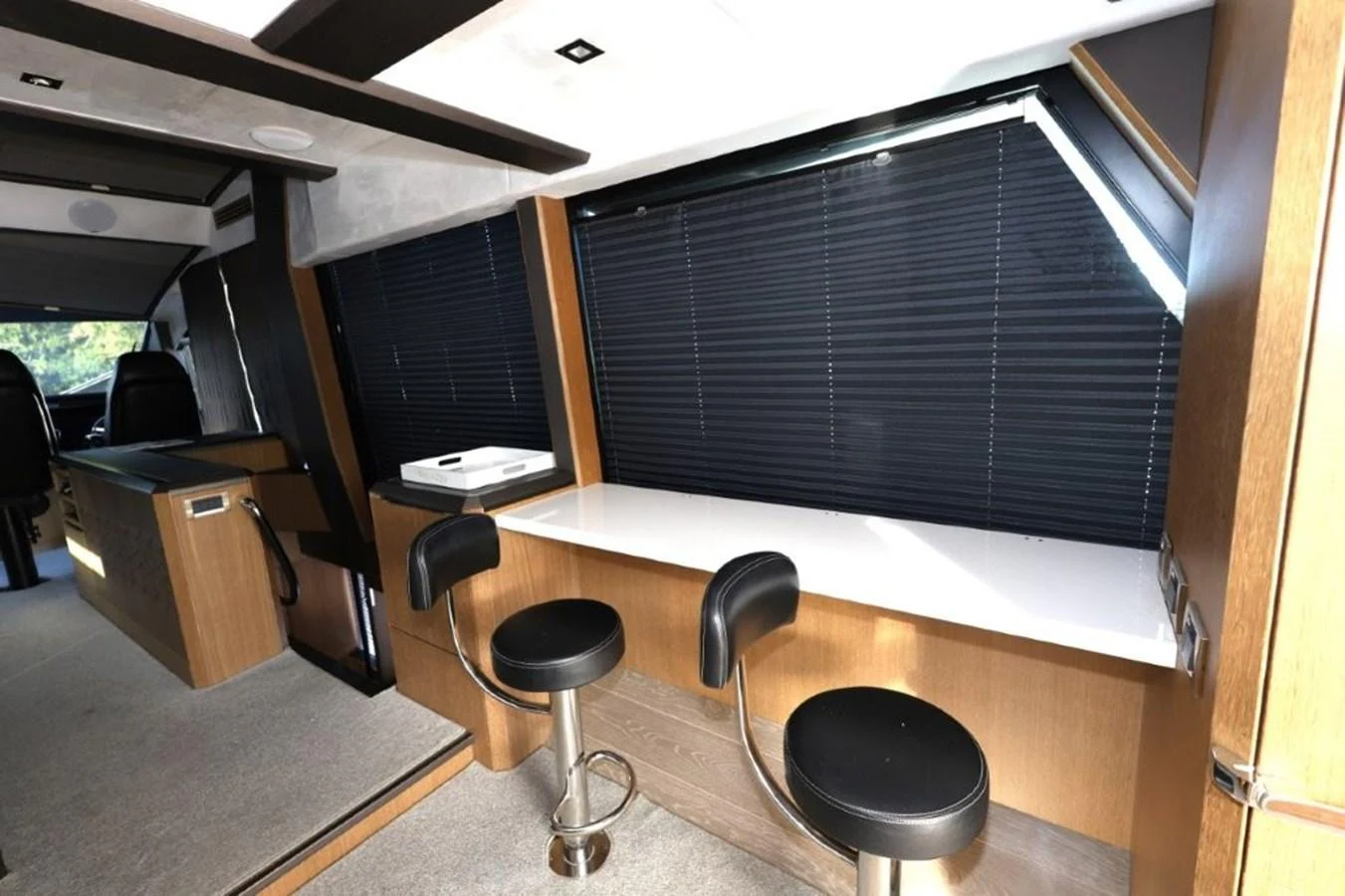 a room with a desk and stools aboard GLN65001J819 Yacht for Sale