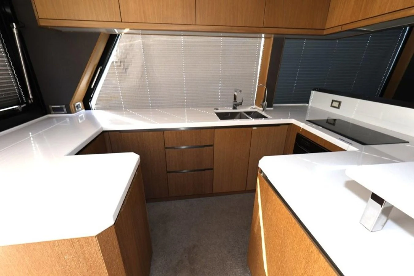 a kitchen with wooden cabinets aboard GLN65001J819 Yacht for Sale