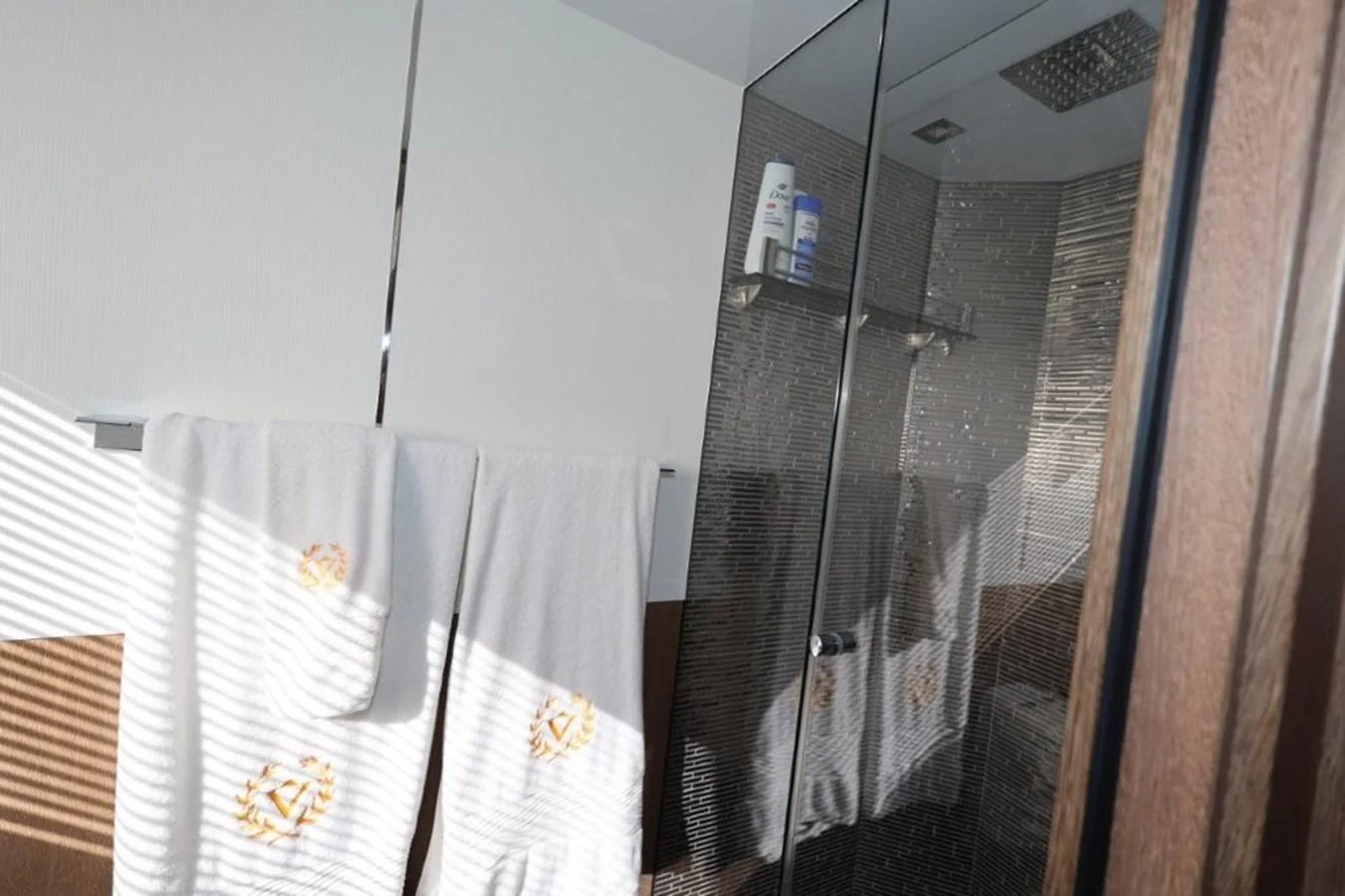 a window with a curtain and a mirror aboard GLN65001J819 Yacht for Sale