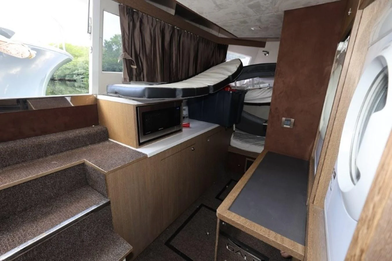 a room with a bed and a couch aboard GLN65001J819 Yacht for Sale