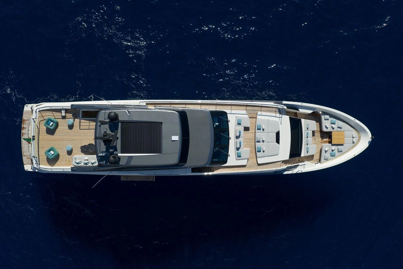 Aerial view of a luxurious yacht cruising on deep blue waters. aboard LADY LU' Yacht for Sale