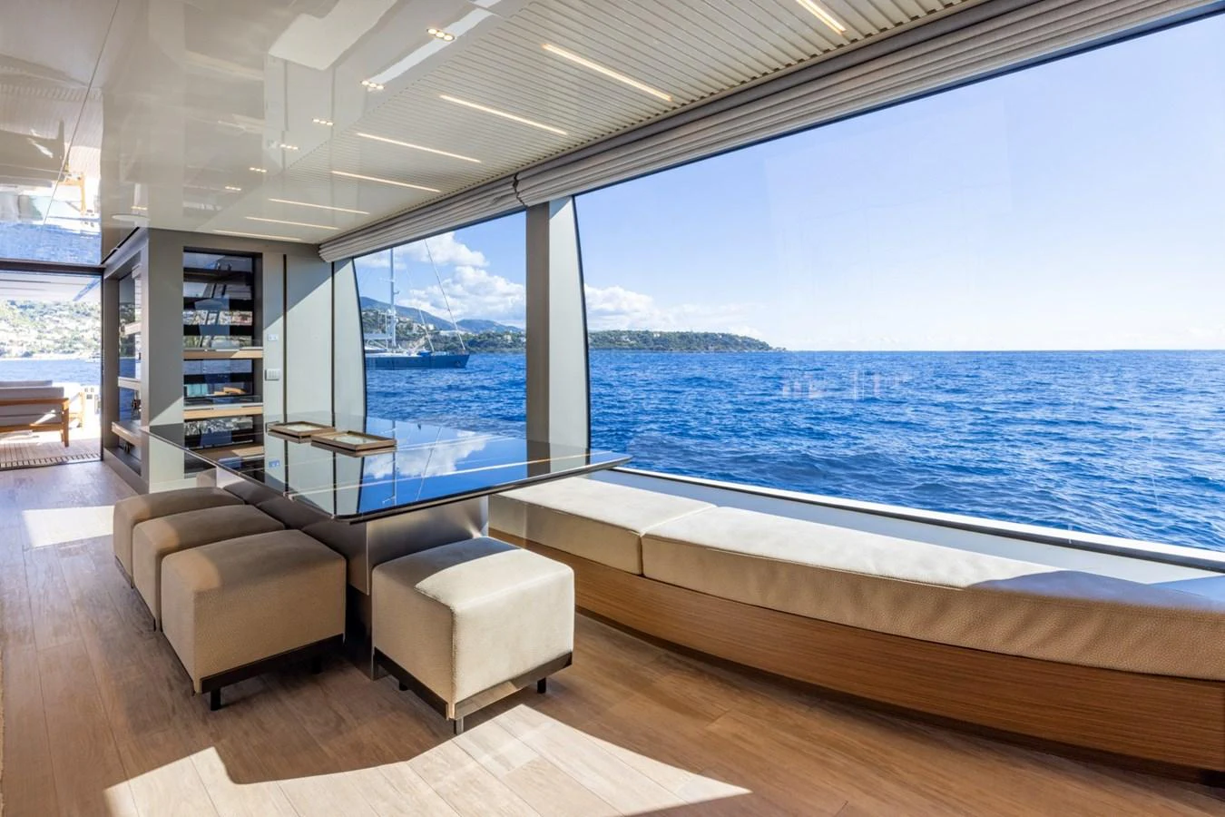 The salon offers stunning panoramic views of the sea through large windows. aboard LADY LU' Yacht for Sale